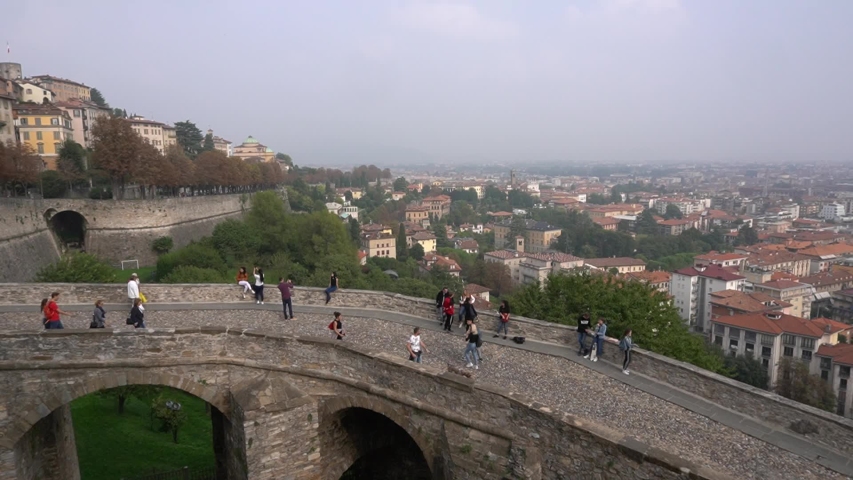 Bergamo, Italy. The old town. Landscape at the ancient gate Porta San Giacomo and the Venetian walls - tourist visiting the city