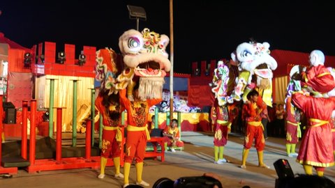 Nakhon Sawan, Thailand-February 16, 2018: Dragon dance celebrating Chinese Lunar New Year