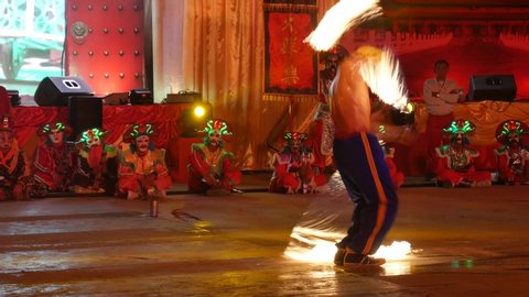 Nakhon Sawan, Thailand-February 16, 2018: Fire performers in Nakhon Sawan to celebrate Chinese New Year in Thailand.