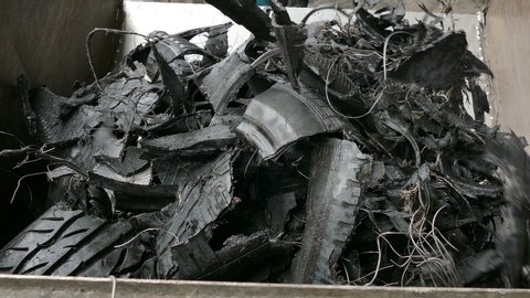 Cutting rubber into pieces at a tire factory / Tires as raw material for recycling