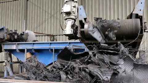 Recycled tires as raw material for processing / Conveyor belt with cut pieces of recycling tires