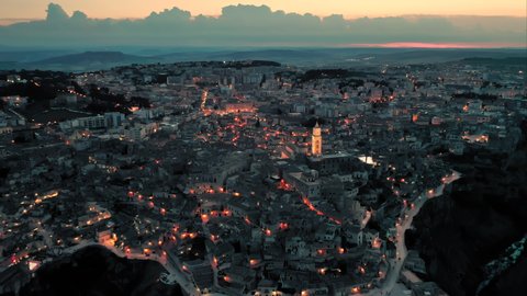 Beautiful evening view of the historic old town Matera, Basilicata, Italy - a european capital of culture. Aerial cityscape shot.