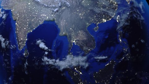Zoom out of Thailand through clouds to see the Earth from space.
