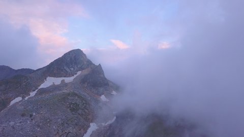 Tete Fenetre summit wrapped in clouds, Grand St Bernard, Switzerland