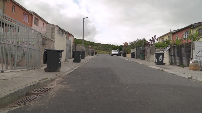 Typical street of low-cost housing in the Cape Flats colored townships of Cape Town, South Africa.
