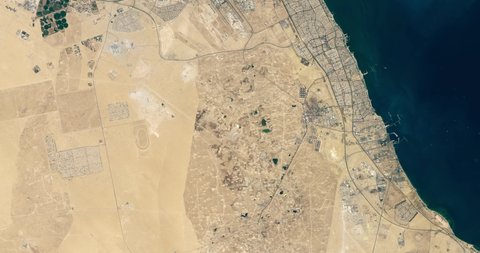 Very high-altitude overflight aerial of Kuwait City and Kuwait Bay. Clip loops and is reversible. Elements of this image furnished by NASA