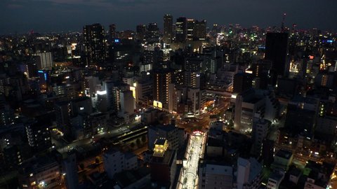 OSAKA, JAPAN - CIRCA JULY 2019 : Aerial view of CITYSCAPE of OSAKA at night. Osaka is the capital city of Osaka Prefecture and the second largest metropolitan area in Japan.