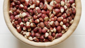 healthy raw cowpeas beans in wood bowl food organic top view texture ,supplementary food, High protein healthy food, HD 1920 × 1080 - panning video footage. 