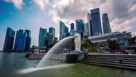 Singapore - February 27, 2015 : Singapore Merlion in front of financial and business district in downtown core time lapse