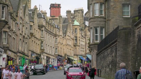 Edinburgh , Scotland / United Kingdom (UK) - 07 31 2019: Typical summer tourism in Old Town Edinburgh on Cockburn Street, days before the city's population will swell to more than 1 million people for