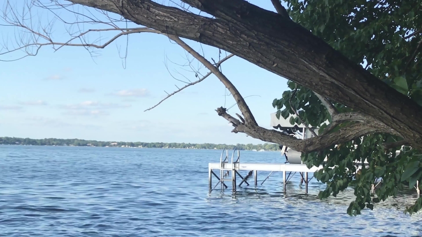boat dock on the side of a wisconsin lake