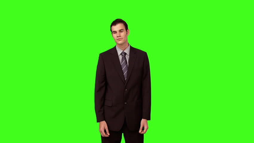 Businessman presenting with his hands on green screen background