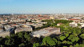 Drone video of Munich city skyline, sunny summer morning, clear blue sky