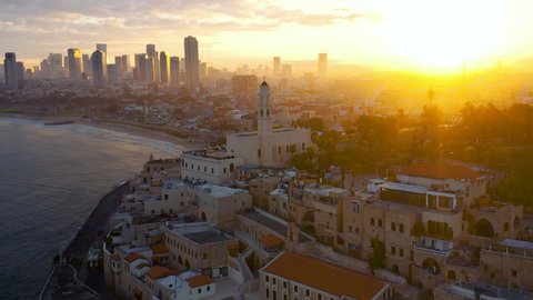 Old city Jaffa and Tel Aviv in Israel, morning sunrise view, 4k aerial drone skyline