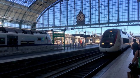 Bordeaux, France - July 2019 : TVG Inoui, French high speed train arriving in the main glass hall of the Bordeaux railway station Gare Saint-Jean