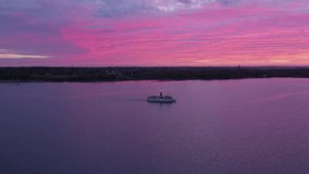 Copenhagen/Denmark  07.09.2019 video from ship  sailing in Roskilde Fjord in pink and purple sunset  ,taken by drone camera