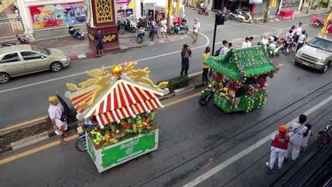 Phuket Thailand - Sept 2019: Phuket Vegetarian festival 2019 - Two motorcycles with sidecars decorated with flowers in honor of the religious Nine Emperor Gods Festival on road of Phuket island