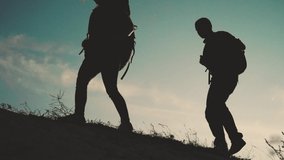 teamwork happy family business travel silhouette slow motion video concept. happy family slow motion video walking on nature. girl and man couple in a field on trekking trip. tourists with lifestyle