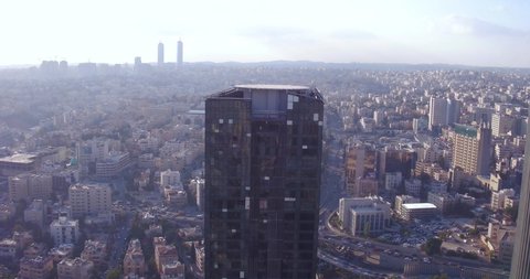 AMMAN, JORDAN - CIRCA 2019 - aerial over the city of Amman, Jordan downtown business district, skyscrapers and offices.
