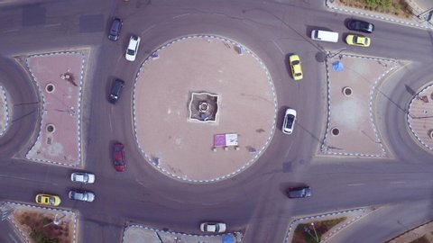 AMMAN, JORDAN - CIRCA 2019 - aerial straight down of traffic circle or roundabout with car traffic, Amman, Jordan.