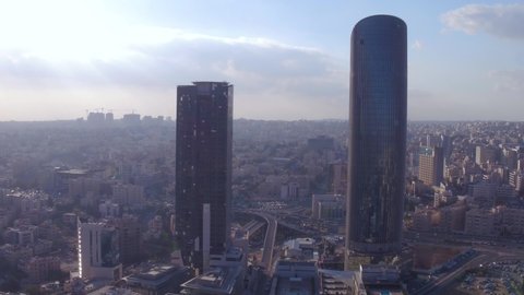 AMMAN, JORDAN - CIRCA 2019 - aerial over the city of Amman, Jordan downtown business district, skyscrapers and offices.