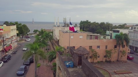 SANTO DOMINGO, DOMINICAN REPUBLIC - CIRCA 2019 - Aerial around the flag of the Dominican Republic in Santo Domingo.