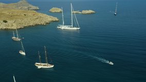 Aerial birds eye view drone video Anthony Quinn and Ladiko bay on Rhodes island, Dodecanese, Greece. Panorama with nice lagoon and clear blue water. Famous tourist destination in South Europe