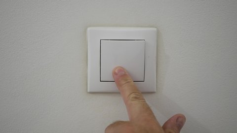 Man Hand Open Light Pushing the Button from Office Wall