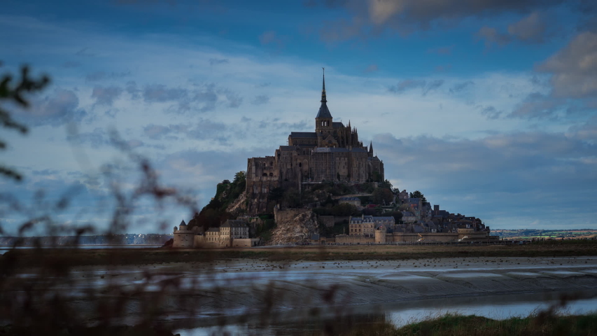 Time lapse Mont Saint-Michel with cloudy sky at sunset