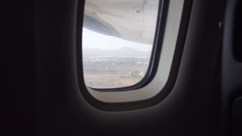 Turbulence before landing on the take-off at the airport, view from the window