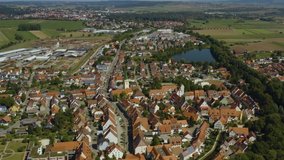 Aerial view of the city Hüffingen in Germany in the black forest on a sunny day in summer. Tilt down with wide view of the old town.
