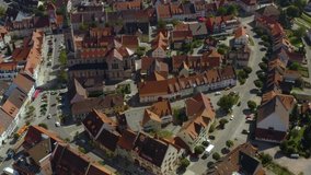Aerial view of the village Bräunlingen in Germany in the black forest on a sunny day in summer. Pan to the left beside the church.
