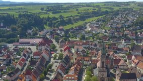 Aerial view of the village Bräunlingen in Germany in the black forest on a sunny day in summer. Tilt down to the old town.