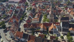 Aerial view of the village Bräunlingen in Germany in the black forest on a sunny day in summer. Pan to the right in front of the church.