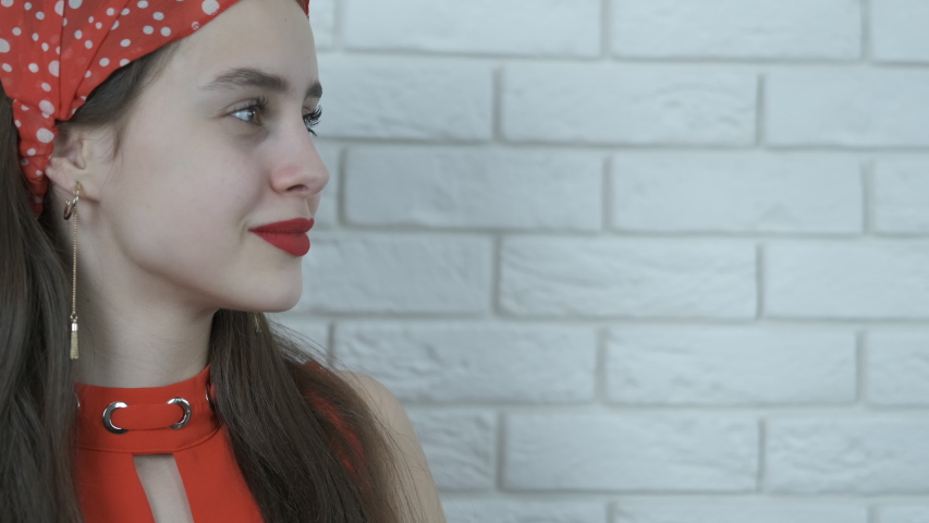 Beautiful girl in a red scarf.