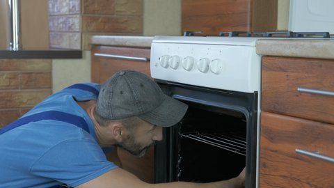 Fix An Oven A Man Stock Footage Video 100 Royalty Free 1039086275 Shutterstock