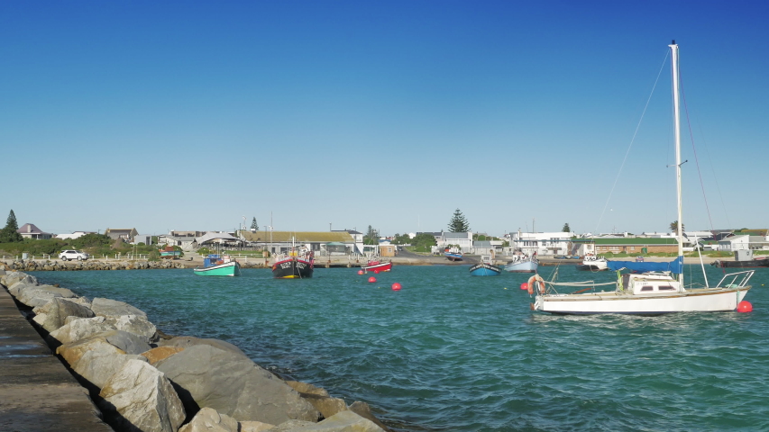 Boats floating in harbour, Struisbaai, South Africa