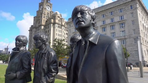 LIVERPOOL, MERSEYSIDE/ENGLAND - AUGUST 13, 2019: Beatles statue at the Pier Head, Liverpool waterfront, England