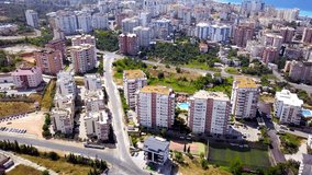 Top view of resort town with hotels and apartment buildings. Clip. Beautiful multi-storey houses with beautiful exterior of resort town in summer