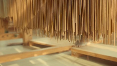 Manual loom powered for textile production as part of a weaving process