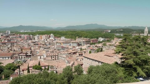 View of Catalonian Girona. Antique Spanish city. View from fortress wall. Roofs of buildings of small town