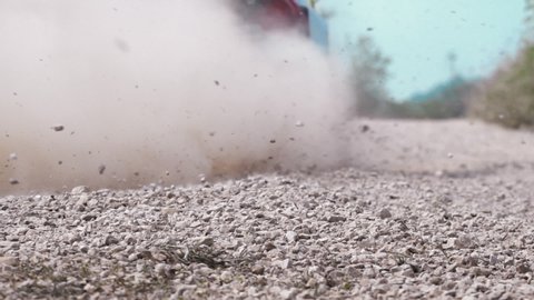 Slow motion, rally race car drifting on dirt track