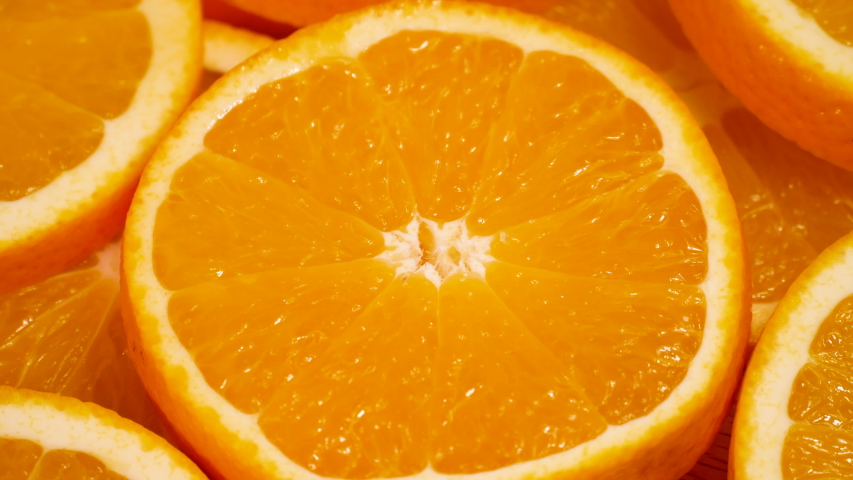 Macro shot of orange fruit and rotate.Close up fresh citrus orange. Nature background. Royalty-Free Stock Footage #1038190487