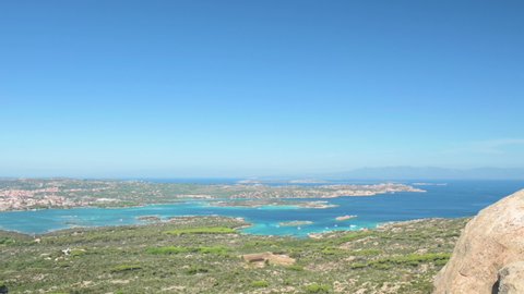 Slow motion video, stunning view of La Maddalena Archipelago with its beautiful bays bathed by a turquoise clear water. La Maddalena Archipelago, Sardinia, Italy.