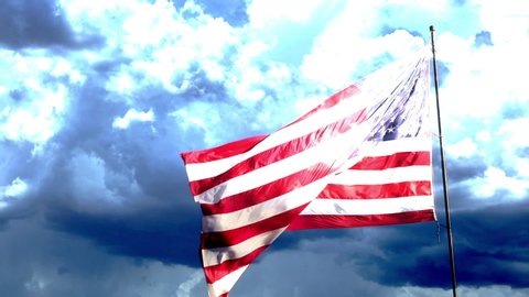 Full HD Ghosted Left Facing Slow Motion American Flag Waving In Wind with Turbulent Time-lapse Storm Clouds