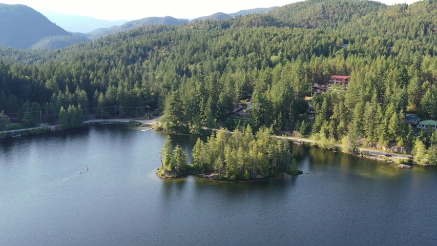 Aerial View at Mountain Lake with Blue Sky in British Columbia, Canada. 4K.