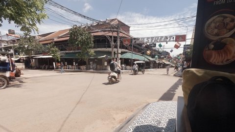Siem Reap / Cambodia - 09 11 2019: Timelapse of Police Stopping Traffic To Take a Photo on Pub Street
