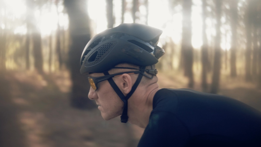 Cyclist Professional Fit Man On Triathlon Bicycle.Triathlete Training On Bike. Cycling Exercise On Bike. Cyclist Rider In Helmet And Sportswear Riding Workout At Sunset On Triathlon Time Trial Bicycle | Shutterstock HD Video #1038221615