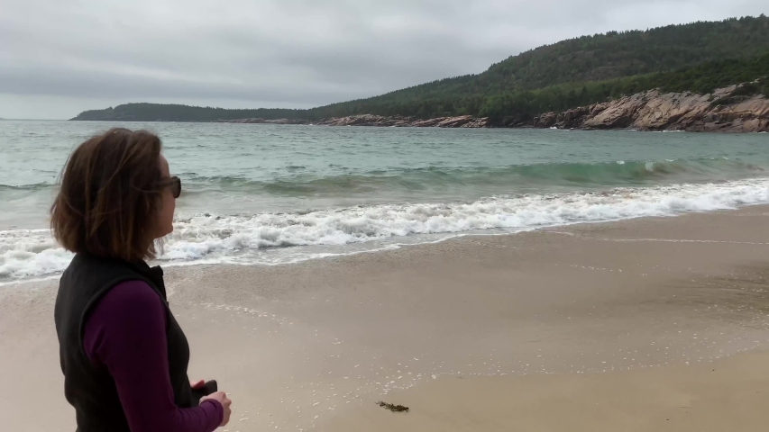 4k Woman Walks Thinking on Sand Beach in Acadia National Park