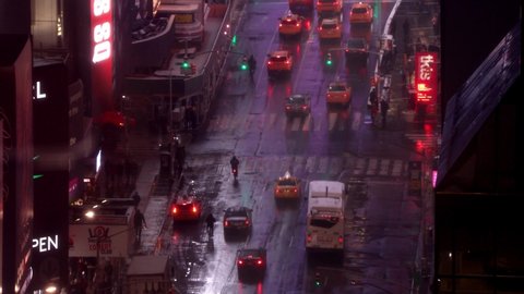 New York City , ny / United States - 05 25 2019: Cars running on street. Night time on Manhattan street, New York. Winter, snow.